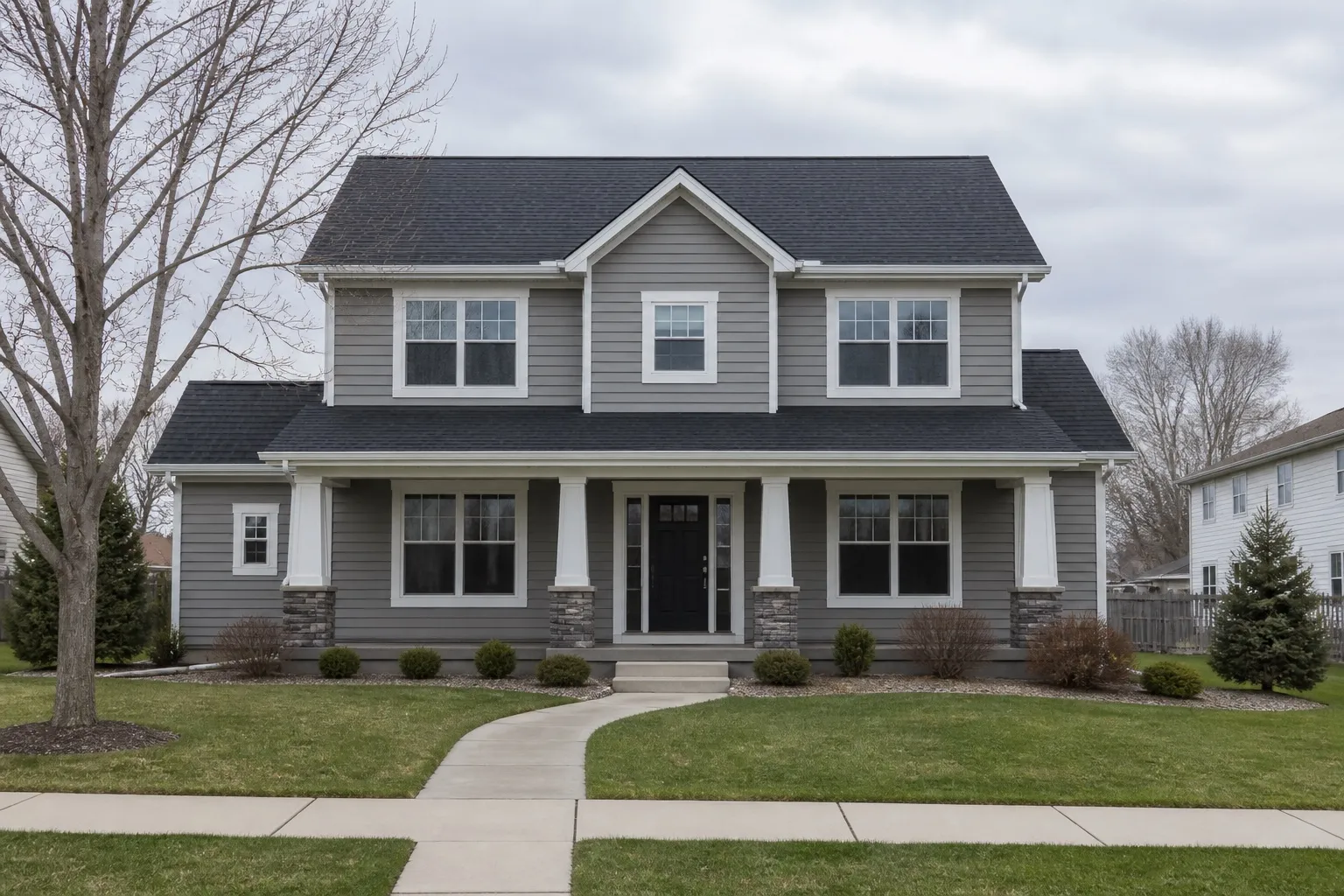Front elevation of a two-story home showing roof, siding, windows, and gutters